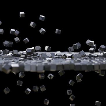 Floating metallic cubes above a reflective surface.