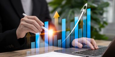 Businessman interacting with virtual graph showing growth.