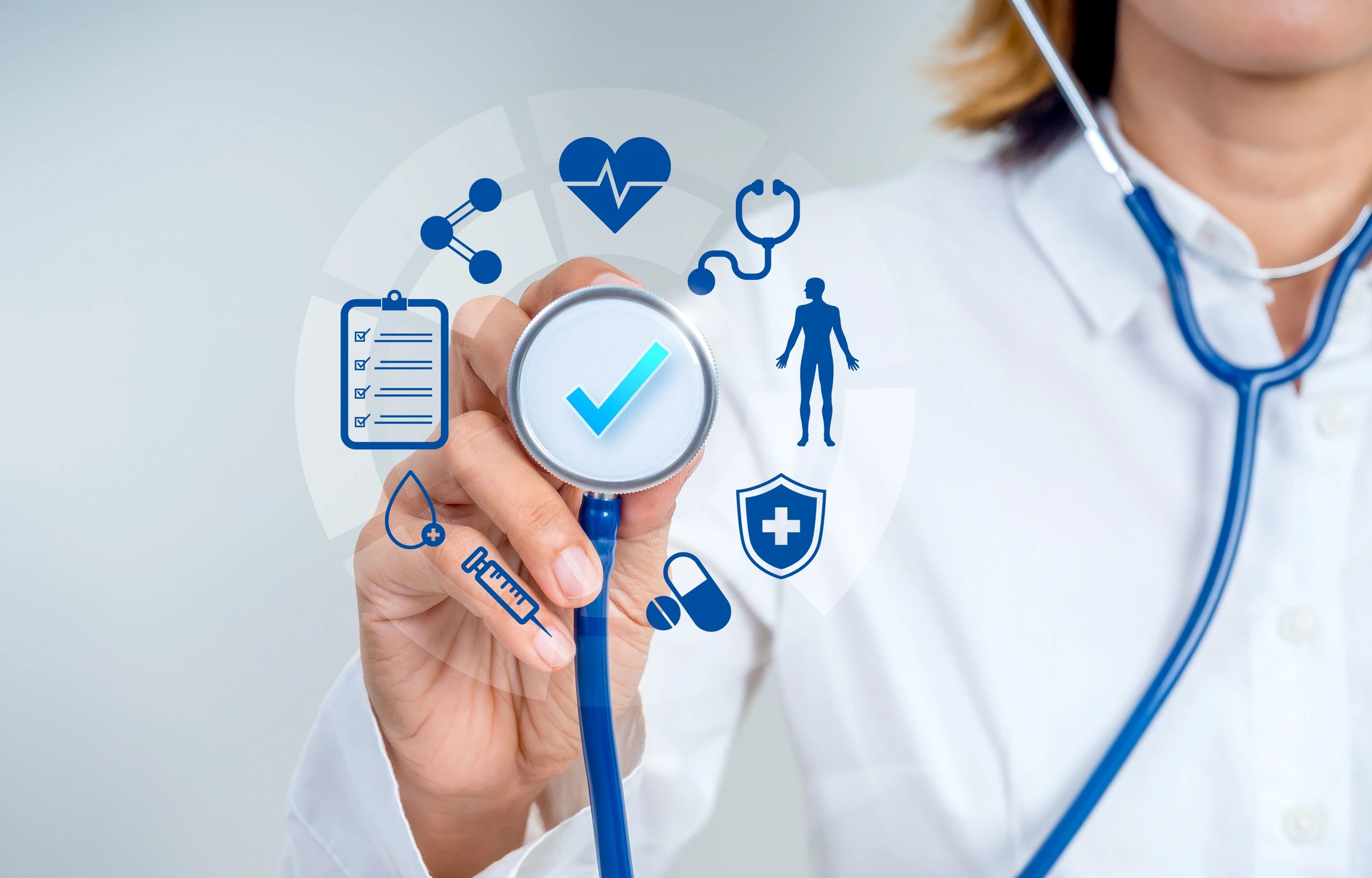 Doctor holding a stethoscope with medical icons around.