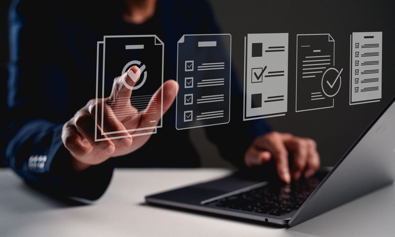 A person interacts with a digital interface, managing documents and checklists, showcasing technology and productivity in a modern workspace.