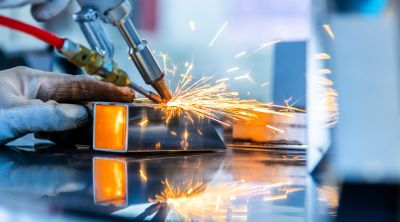 Close-up of welding metal with sparks flying.