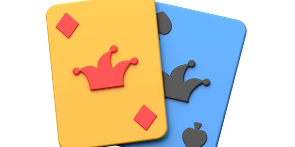 Two colorful playing cards with crown symbols, one yellow and one blue.