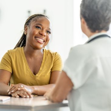 Two women engaged in a friendly conversation.