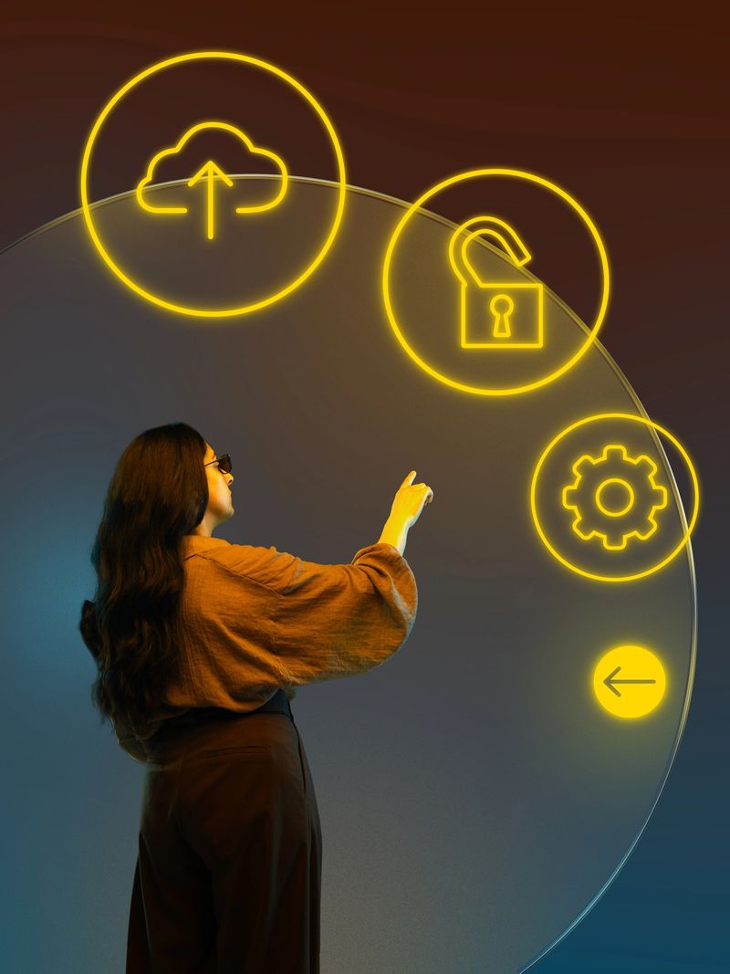 Graphic composition. Woman touching holographic icons of cloud upload security and digital settings. Concept of cloud computing, data protection, SaaS infrastructure, UI interface design.