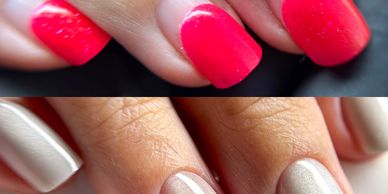 Close-up of hands showing glossy red and nude manicured nails.