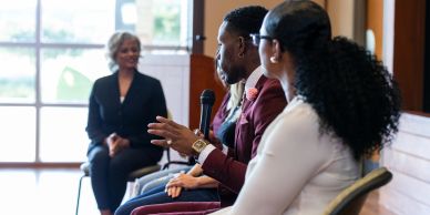 People engaged in a discussion or panel talk.