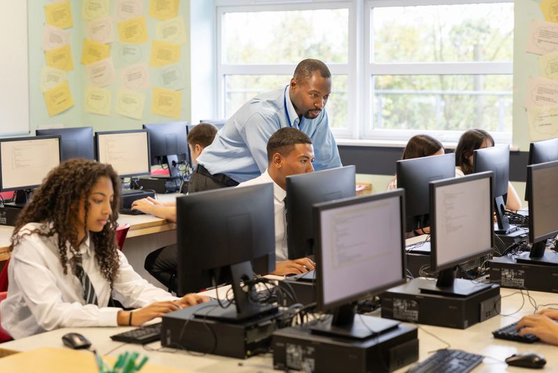 High school students in modern computer filled classroom