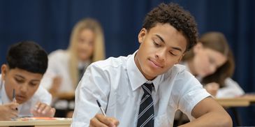 Students focused on writing in class.