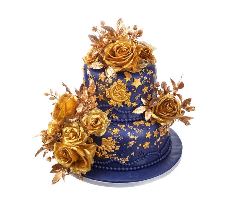 Luxurious multitiered gold cake, Ornate wedding confection with detailed piping design, Extravagant navy themed wedding cake with gold accents and embellishments