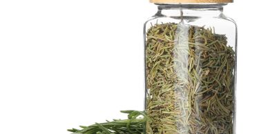 Glass jar filled with dried rosemary and fresh sprigs.