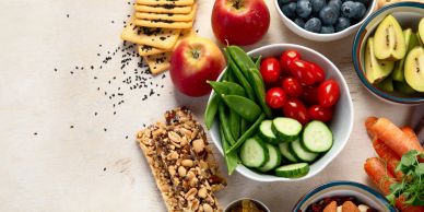 Healthy snacks including fruits, vegetables, and nuts.
