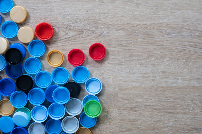 Close up plastic bottles cap for recycling to conserve the environment, recycling, reuse, garbage disposal, save the world concept