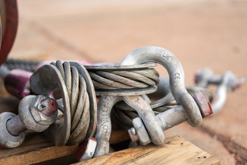 Wire rope sling and shackle device, equipment for heavy lifting in crane operation, there are in brand new condition. Industrial equipment object with close-up.