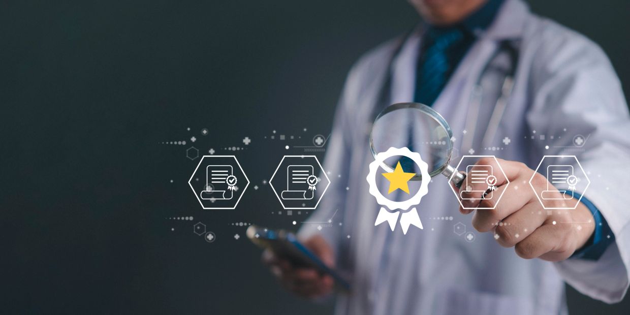 Doctor examining certification with magnifying glass.