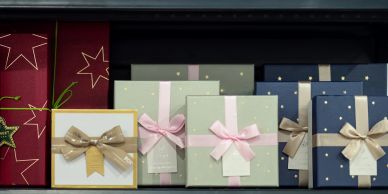 Assorted wrapped gift boxes with bows and tags.