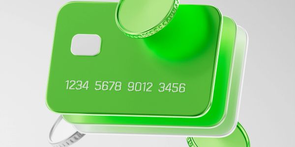 Green credit card with floating coins symbolizing digital finance.