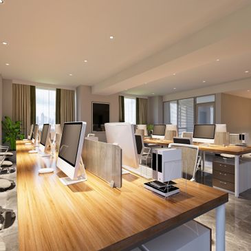Modern office workspace with rows of computers on wooden desks.