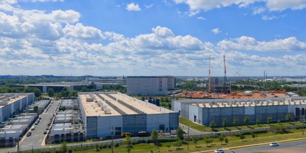 Aerial view of industrial buildings on a sunny day.