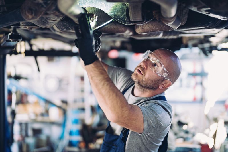 Mechanic working in auto repair shop