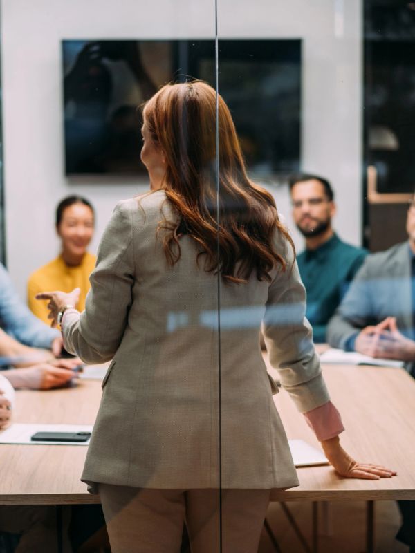 A woman leading a business meeting.