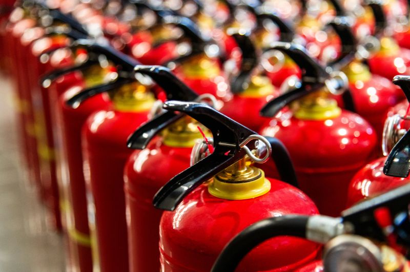 Rows of red fire extinguishers, fire prevention