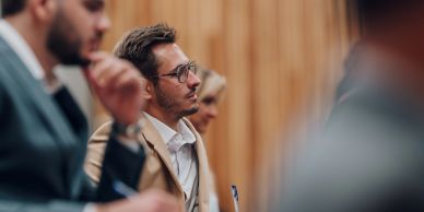 Man attentively listening in a meeting.