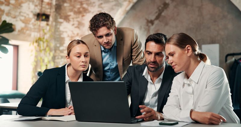 Team, laptop and research with business people in office for meeting, investment proposal and update. Broker planning, feedback and admin review with employees in finance agency for collaboration