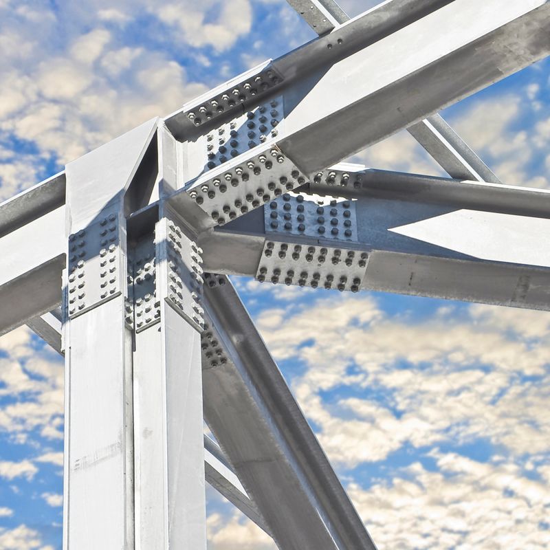 DETAIL OF A NEW PRECAST STEEL STRUCTURE with pillars, steel beams and bolts in galvanized steel