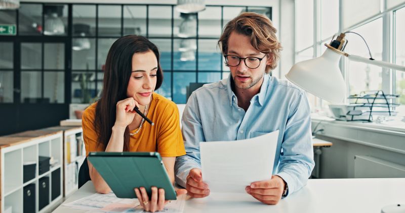 Review, paper or people in office with tablet, support or reading of financial statement. Team, audit document or analyst in agency with tech, online finance report or balance sheet for data entry.