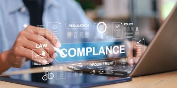 Person using a stylus on a tablet with compliance and regulation icons.