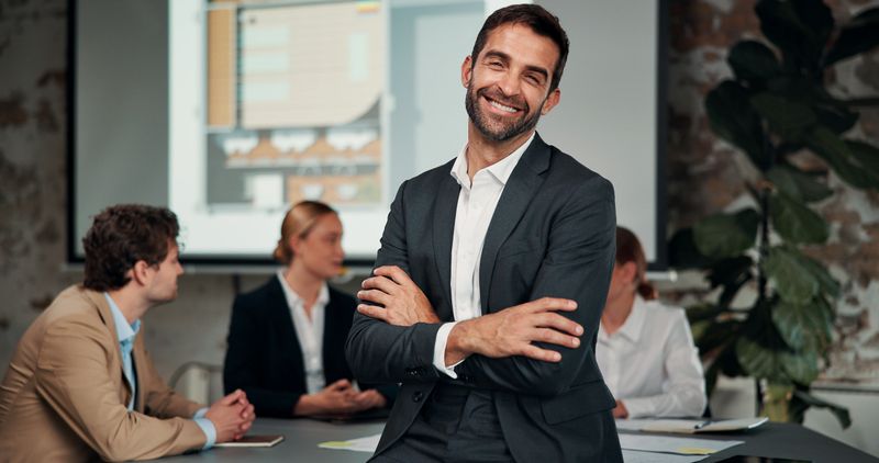 Presentation, businessman and portrait with arms crossed in office for finance meeting and about us. Happy, people and financial manager for risk management, compliance or investment pitch in Denmark