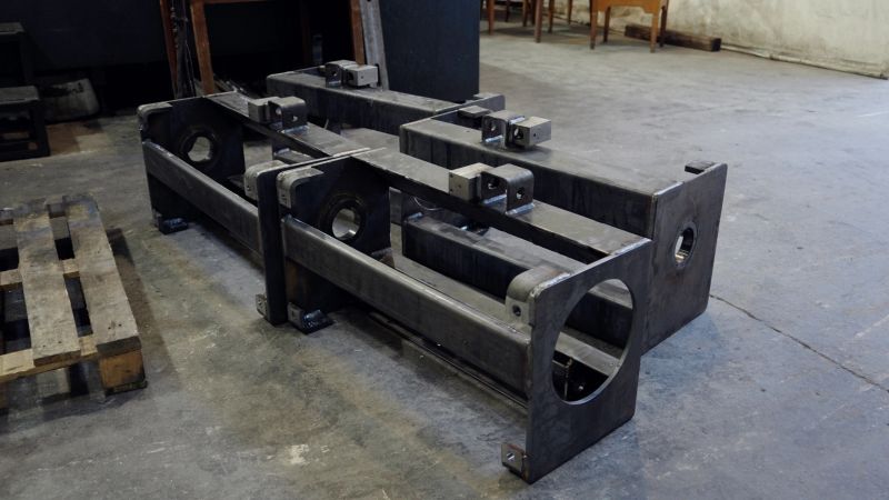 Close-up shot of shiny production elements in modern manufacturing warehouse. Metal machine products background. Modernization in the industrial sector concept.