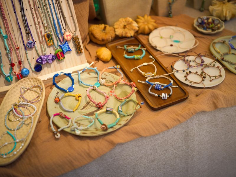 Display of Handmade Colorful Jewelry at a Craft Market Booth