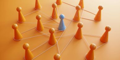 Blue pawn connected to multiple orange pawns symbolizing network or leadership.