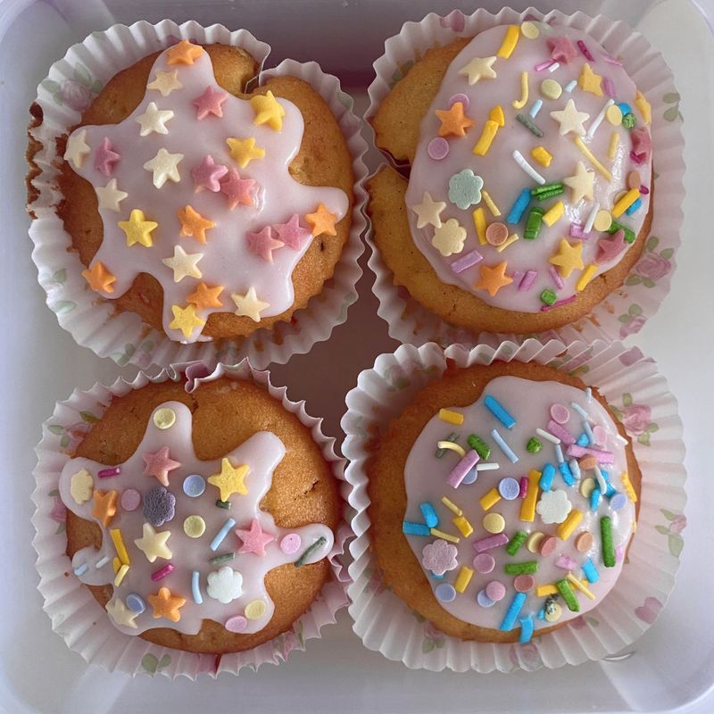 A delightful cupcake topped with rich frosting and decorative sprinkles. Perfect for dessert photography, showcasing the charm and sweetness of baked goods, ideal for parties and celebrations.