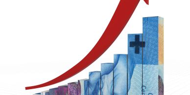 Rising red arrow over stacked banknotes symbolizing financial growth.
