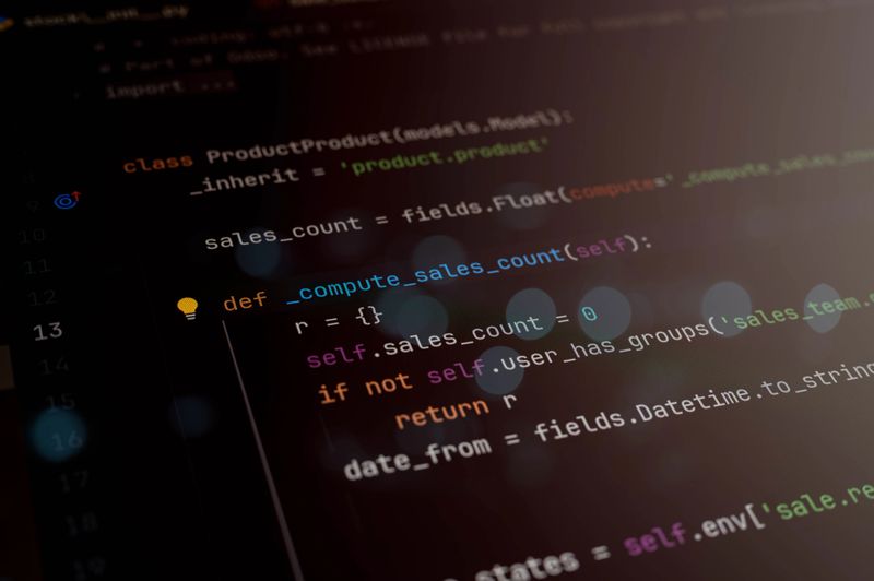 Close-up of Python code editor screen showing a function to compute sales count, used in business logic or software development. Ideal for coding, programming, and data-driven application topics.