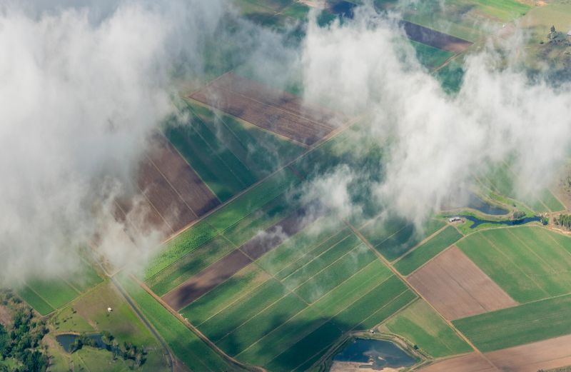 Aerial photograph of an agricultural field under the clouds.