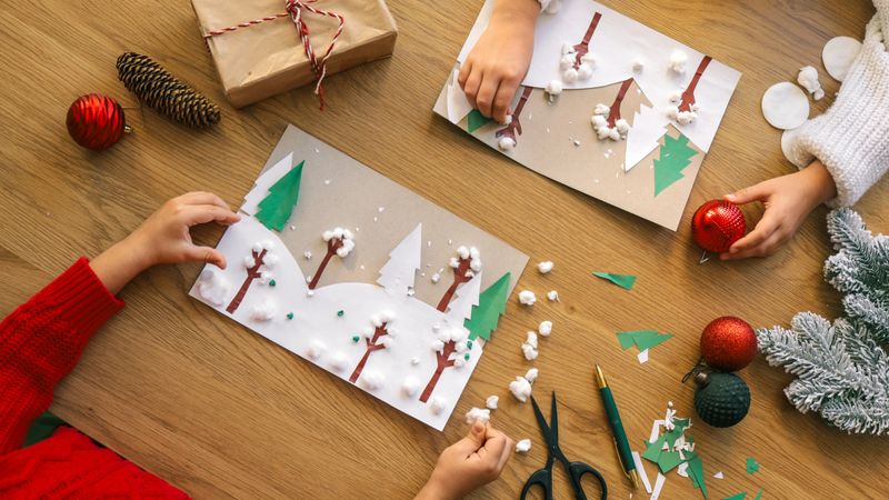 Kids create festive holiday art projects with paper, cotton, and ornaments, perfect for seasonal celebrations