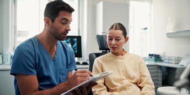 Doctor explaining medical information to patient.