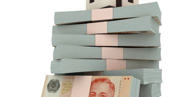 Stacks of Thai baht banknotes bundled together.