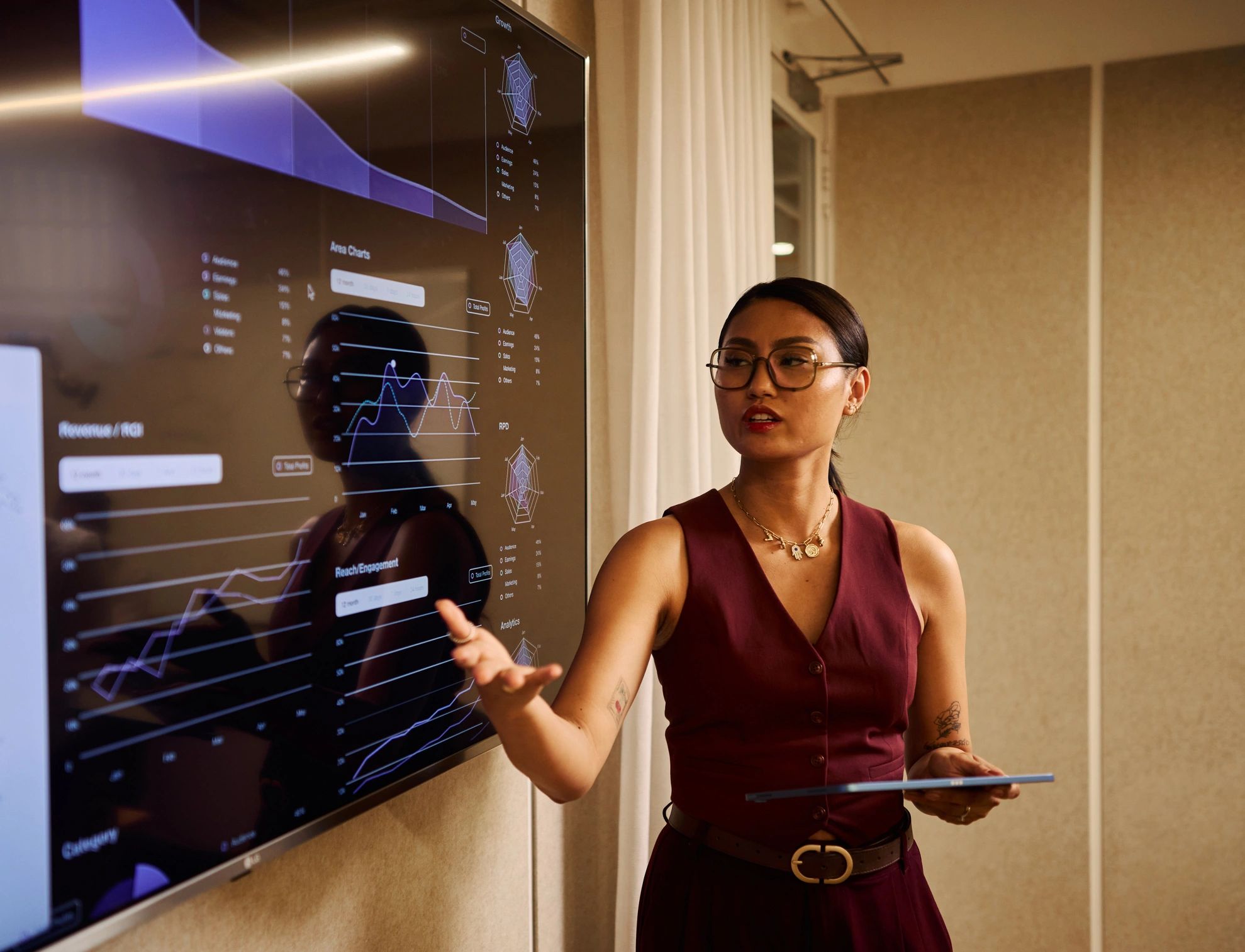 Team member presenting client data on a large screen