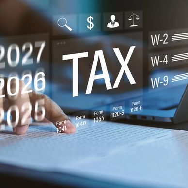 Person reviewing tax documents with digital tax forms overlay.