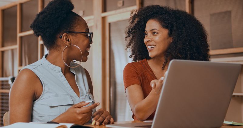 Staff, manager and digital to review finance report, support and advice of startup. Creative, people and laptop with discussion in office for training, coaching and brainstorming ideas of project.