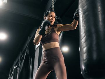 Woman boxing in a gym.