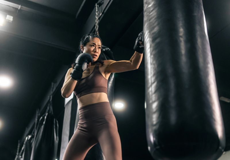 Asian woman training boxing empowerment and strenght