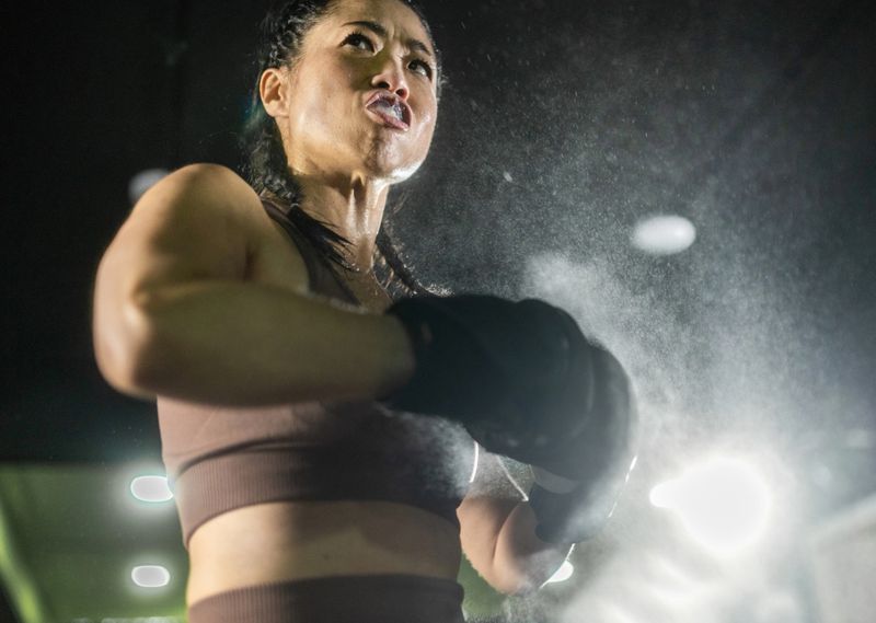 female boxer getting motivated before the fight. portrait