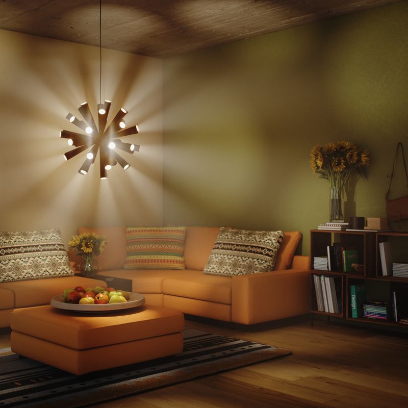 Digitally generated warm evening scene of a modern living room with a glowing black pendant lamp casting dramatic light beams through soft atmospheric haze. An orange sectional sofa with patterned cushions, a low ottoman, striped rug and a wooden bookcase with sunflowers and books complete the cozy interior.