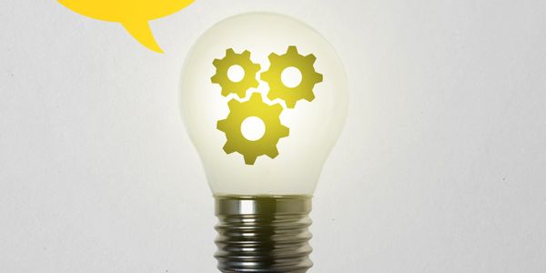 Light bulb with gears inside symbolizing innovative ideas.