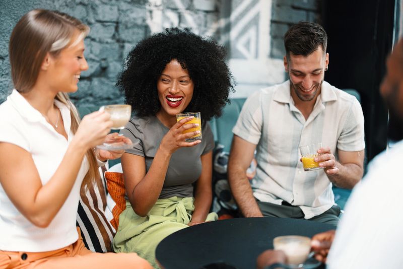Gen Z group enjoying non-alcoholic drinks during a fun meetup